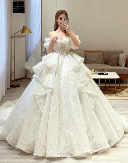Elegant Off-the-Shoulder Puff Sleeve Sparkling Sequin Lace Ruffled Layered A-Line Wedding Dress TP5956