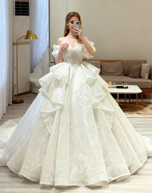 Elegant Off-the-Shoulder Puff Sleeve Sparkling Sequin Lace Ruffled Layered A-Line Wedding Dress TP5956